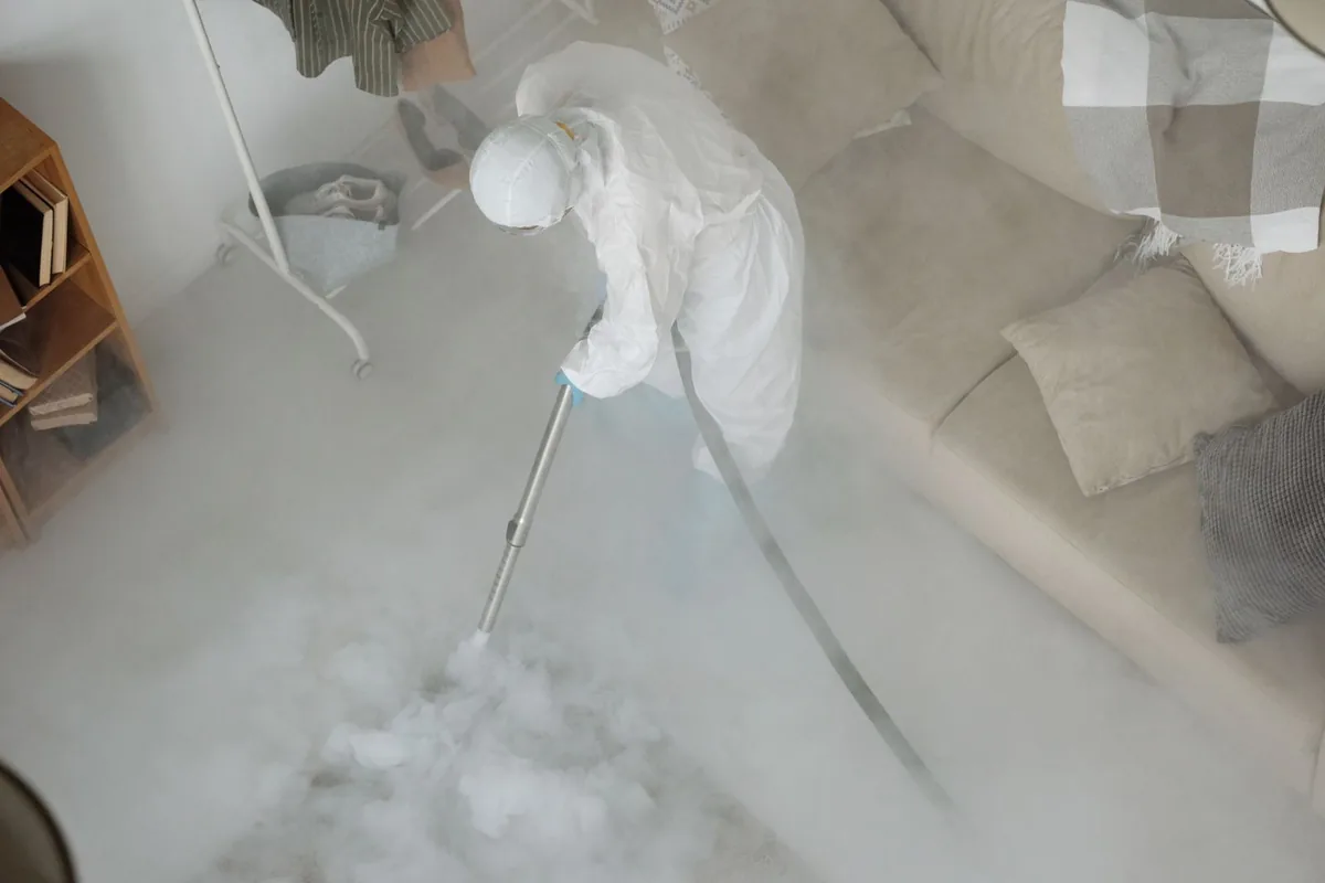 Biohazard cleanup technician in protective equipment, West Hills, NY